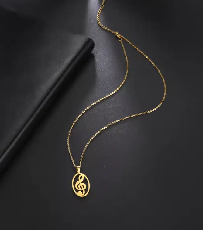 Gold Treble Clef Pendant in and Oval Frame with Chain