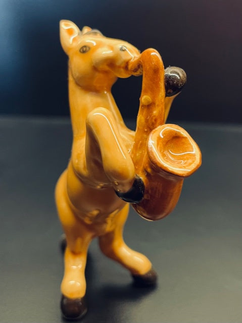 Porcelain Figurine - horse playing the saxophone.