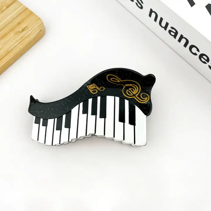 Hair Claw Keyboard with a Gold Treble Clef and Semiquavers