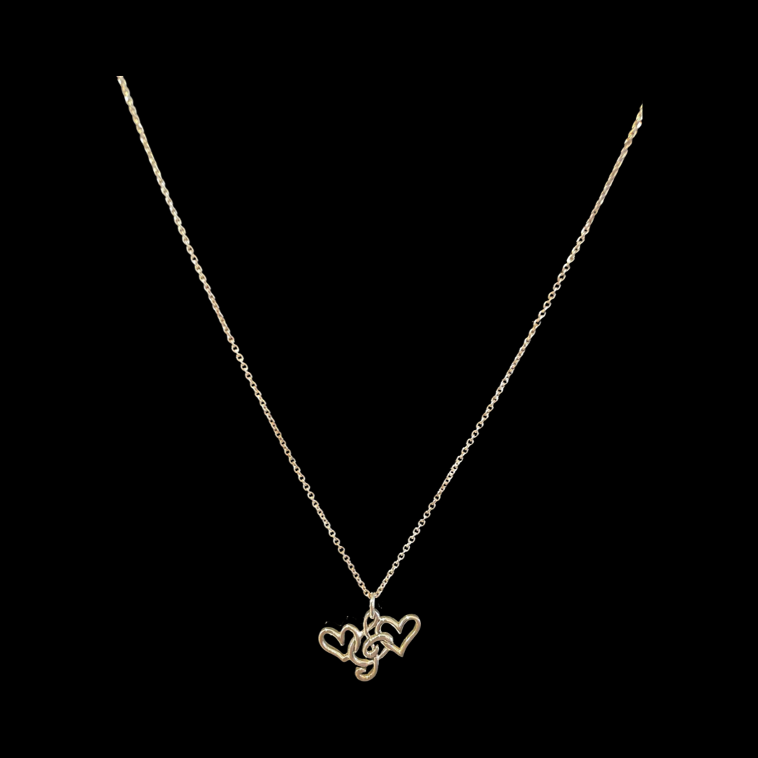 ***$45.95***Sterling Silver Chain & Pendant. Two hearts entwined in a treble clef. “Music is love, love is music.” 40cm chain with a 5cm expansion.