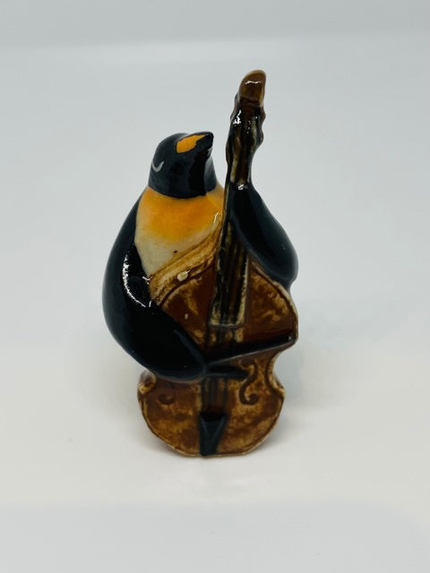 Porceline Penguin with a Double Bass.