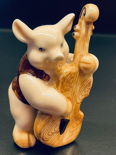 Porcelain Pig Playing the Bass