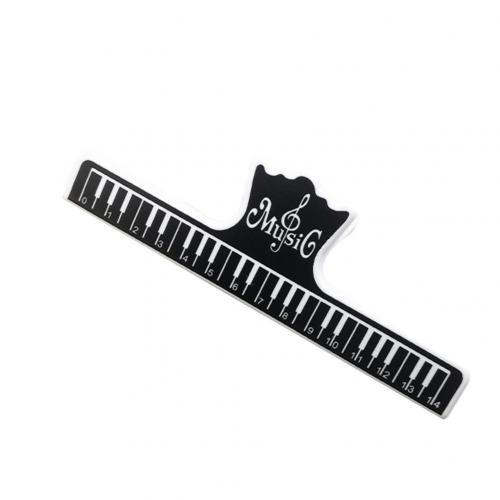 Music of Paper Clip Large Black with a Keyboard