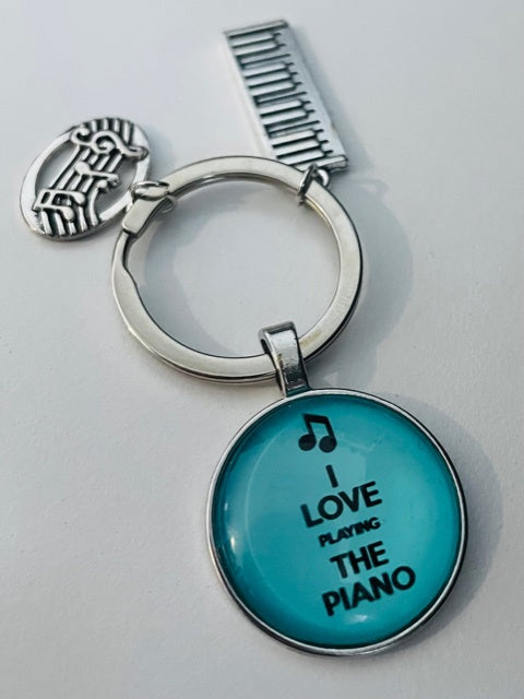Blue Keyring with Pendants - I Love Playing the Piano.