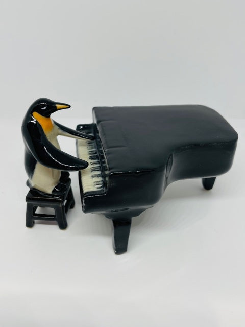 Porcelain Figurine Penguin Playing the Grand Piano.