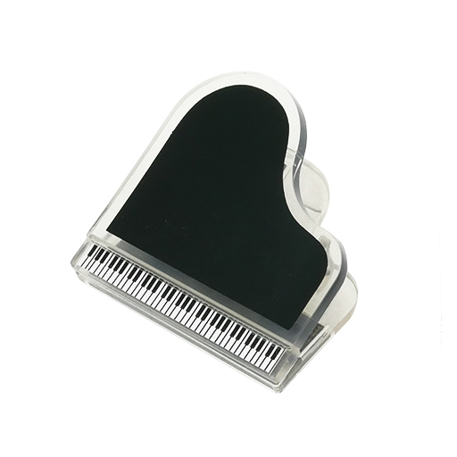 Magnetic paper clip in the shape of a grand piano. Black