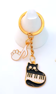 Keyring Cat Cuddling Keyboard with White Paw Note