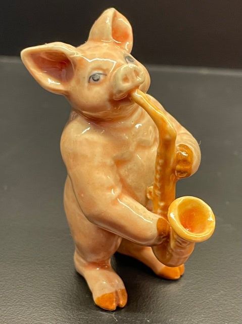 Porcelain Pig Playing the Saxophone