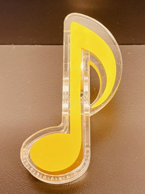 Yellow Paper Clip in the Shape of a Quaver.