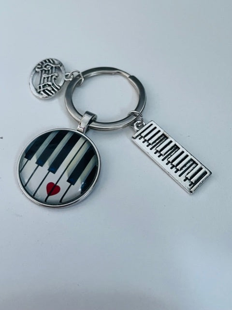 Keyboard Keyring with a Red Heart and Pendants.
