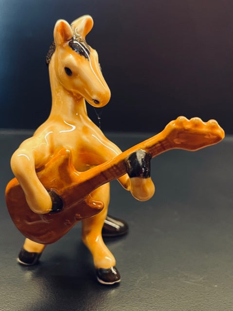 Porcelain Figurine - horse playing the guitar.